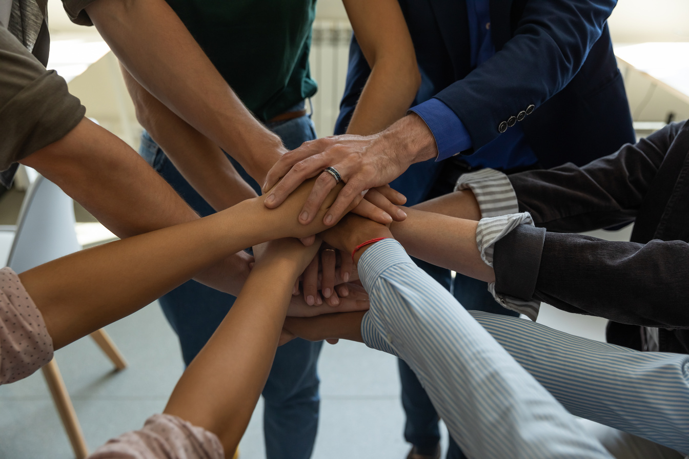 Motivated Team Stacking Their Hands 